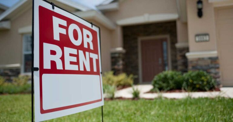 For Rent sign in front of new house stock photo